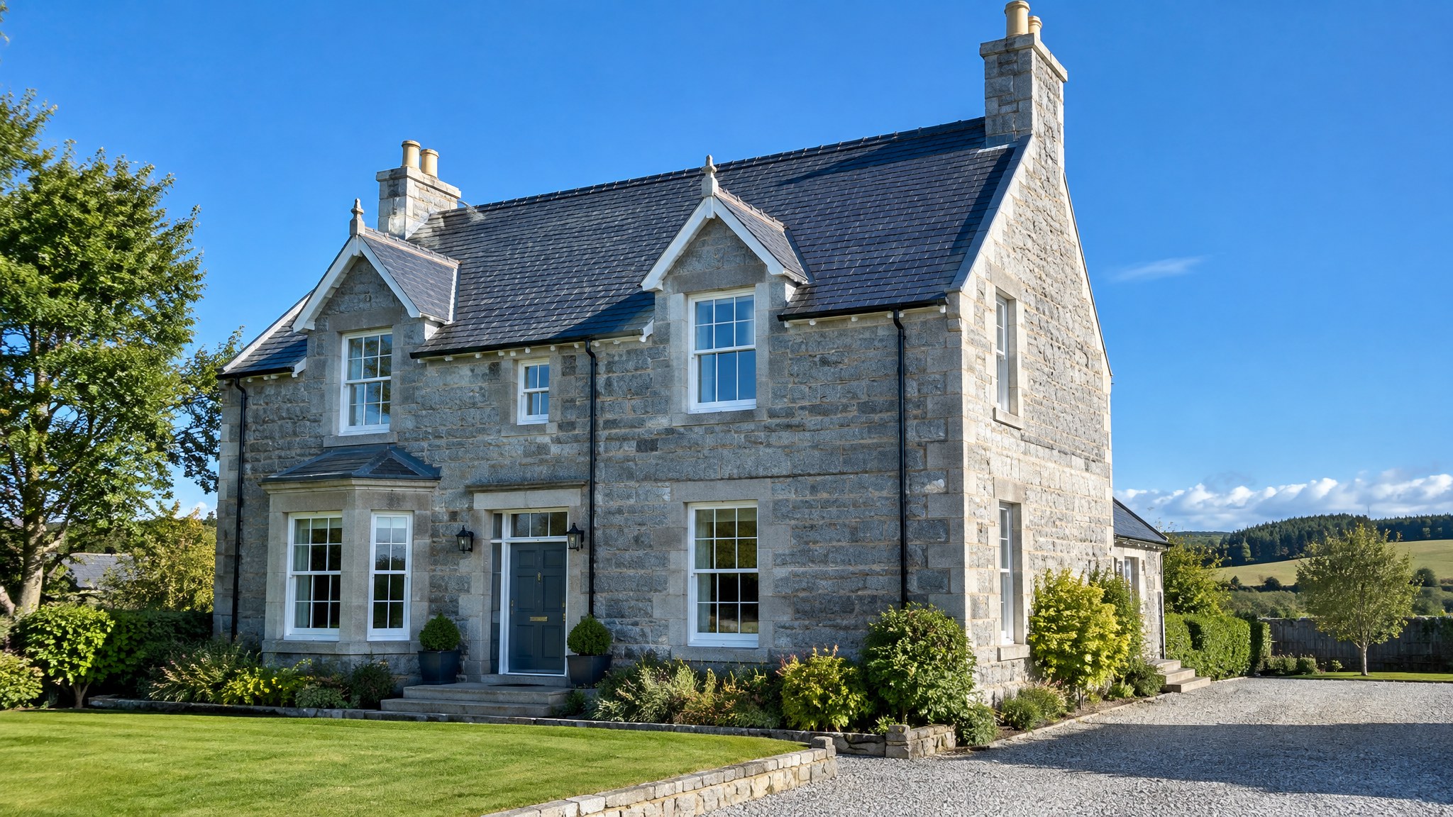 Granite house in Aberdeenshire with a freshly cleaned slate roof